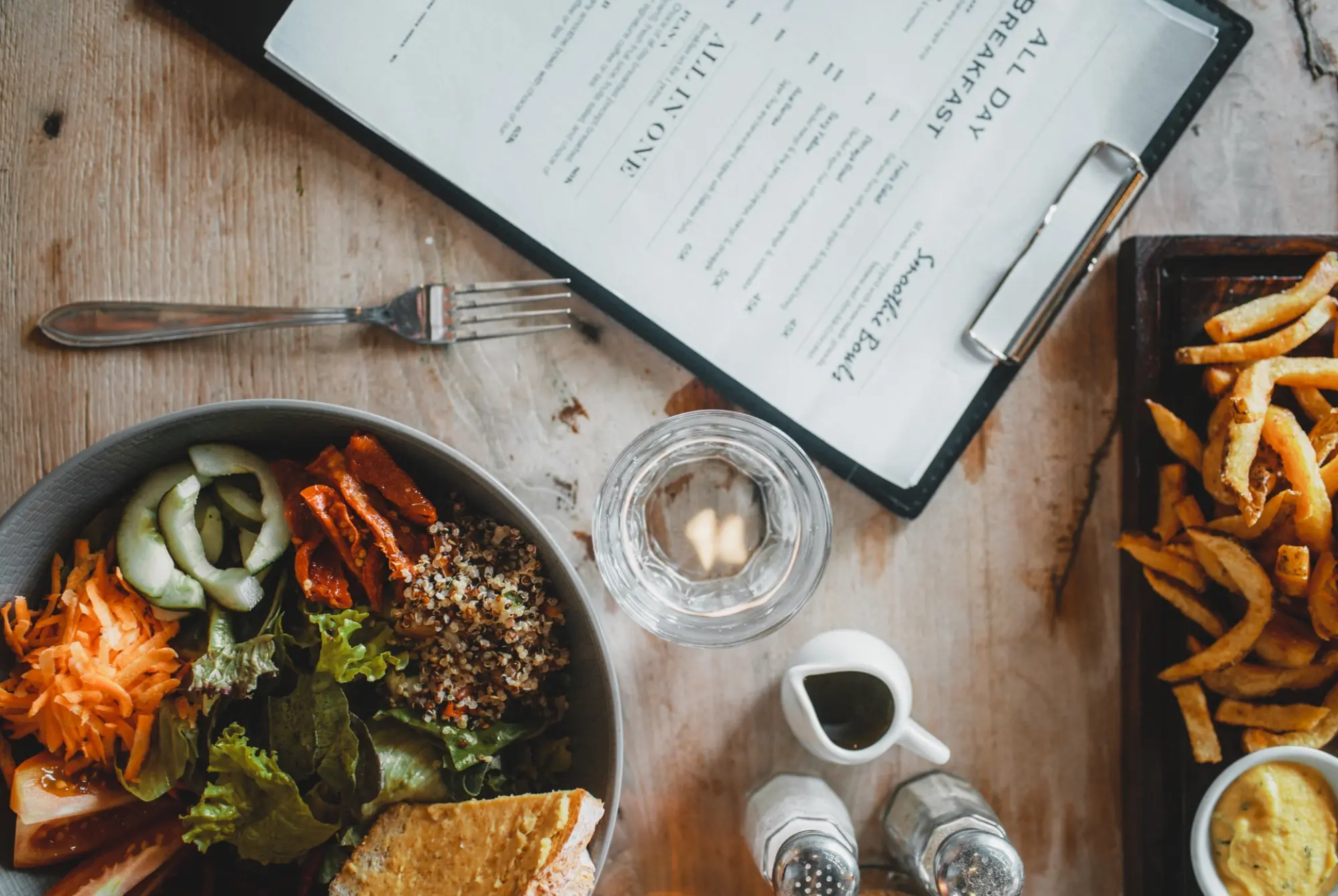 menu and a meal on a table