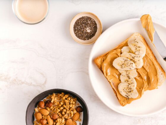 Image showing nuts in different forms including peanut butter on toast and granola with milk.
